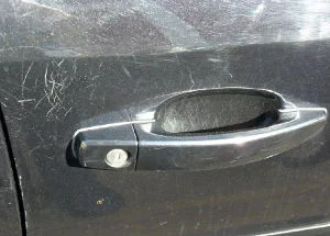 scratches from keys around door handle